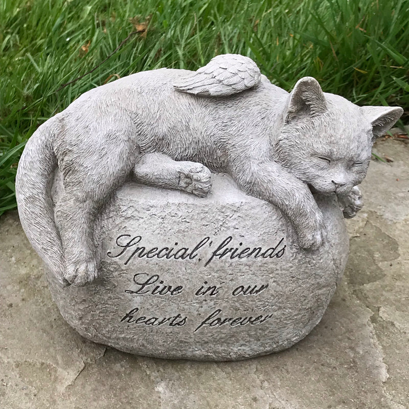 Large Cat with angel wings laying on a stone, lovely memorial, grave marker or pet loss gift