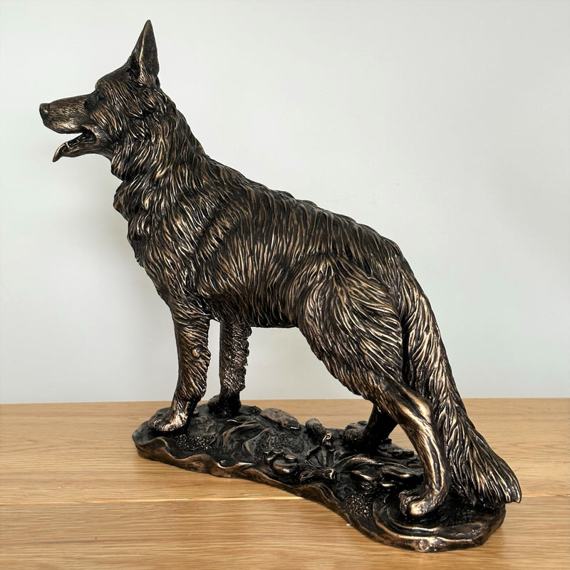 Heavy weight dark bronze effect German Shepherd Dog figurine, 26cm long