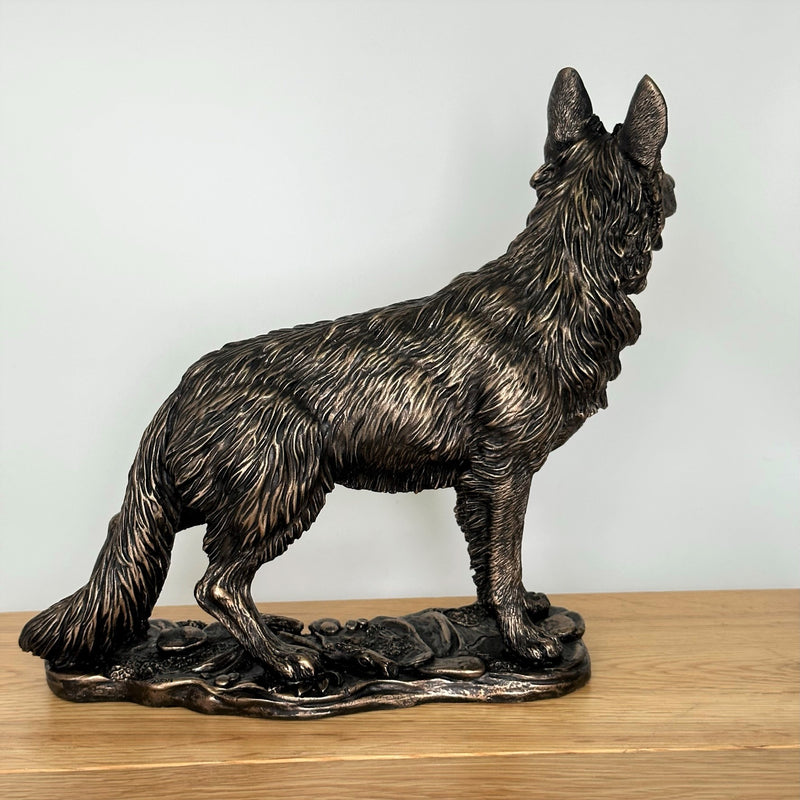 Heavy weight dark bronze effect German Shepherd Dog figurine, 26cm long